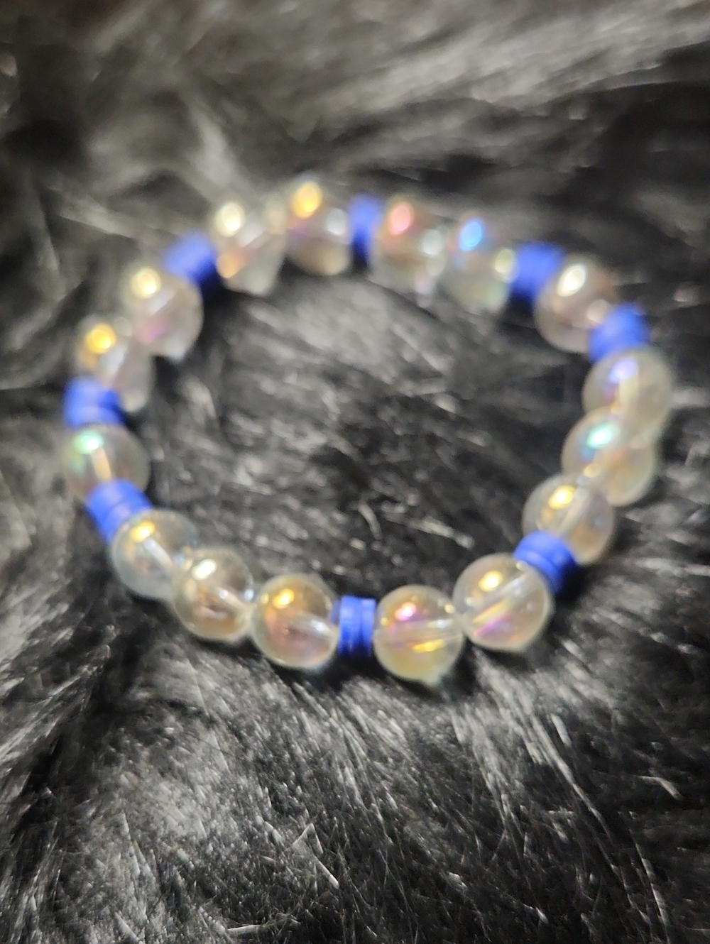 Iridescent Glass Bead Stretch Bracelet with Blue Spacers